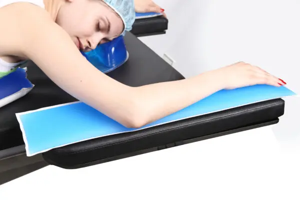 A girl lying with hands on Arm Support Gel Positioners